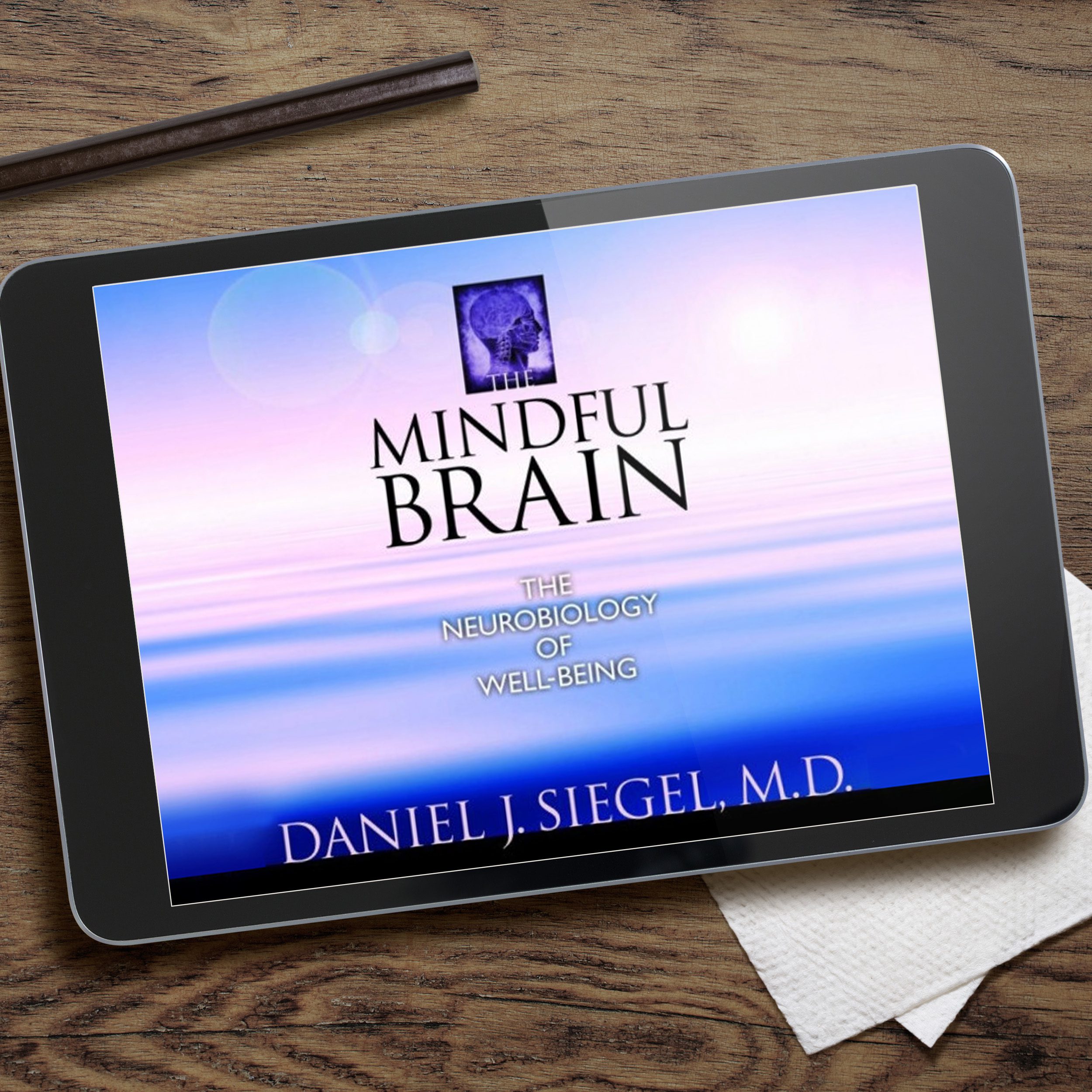 Ipad on table with The Mindful Brain on screen